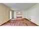 Spacious living room with classic wall paneling, carpet flooring, and view to the dining room at 1970 Fisher Ne Trl, Atlanta, GA 30345