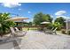 Backyard patio featuring lounge chairs, outdoor seating, a gazebo, and lush landscaping at 3850 Calomel Dr, Cumming, GA 30040