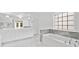Bright bathroom with marble floors, a soaking tub with marble accents, double sinks, and modern fixtures at 3850 Calomel Dr, Cumming, GA 30040