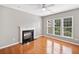 Bright, spacious bedroom with hardwood floors, a fireplace, and several windows at 3850 Calomel Dr, Cumming, GA 30040