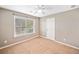 Neutral bedroom with carpet, a window and a ceiling fan, offering comfort and natural light at 3850 Calomel Dr, Cumming, GA 30040