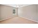 Neutral bedroom with a large window and fan, offering comfort and natural light at 3850 Calomel Dr, Cumming, GA 30040
