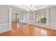 Bright foyer with hardwood floors, columns, and natural light showcases an open floor plan at 3850 Calomel Dr, Cumming, GA 30040