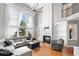 Inviting living room with fireplace, built-in shelving, high ceilings, and large windows at 3850 Calomel Dr, Cumming, GA 30040