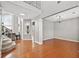 Spacious living room boasts hardwood floors, natural light, and stairs to the upper level at 3850 Calomel Dr, Cumming, GA 30040