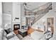 Cozy living room featuring a fireplace, built-in shelves and hardwood floors at 3850 Calomel Dr, Cumming, GA 30040