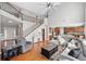 Spacious living room featuring hardwood floors, a staircase, and an open floor plan at 3850 Calomel Dr, Cumming, GA 30040