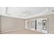 Spacious main bedroom with tray ceiling leading to an ensuite bathroom with double doors at 3850 Calomel Dr, Cumming, GA 30040