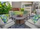 Cozy patio with fire pit and cushioned seating, perfect for outdoor entertaining at 3850 Calomel Dr, Cumming, GA 30040