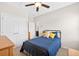 Bedroom with a ceiling fan, closet, and neatly arranged bed at 4160 Grandview Vista St, Cumming, GA 30028