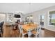 Open dining area with modern lighting, natural light, and flow to living room and outdoor spaces at 4160 Grandview Vista St, Cumming, GA 30028