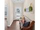 An inviting entryway showcases a wooden bench, decorative pillows, and charming wall decor, creating a warm and stylish first impression at 4160 Grandview Vista St, Cumming, GA 30028