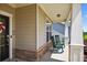 A welcoming front porch features two rocking chairs and a storm door, creating a cozy and relaxing outdoor space at 4160 Grandview Vista St, Cumming, GA 30028