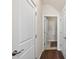 Hallway boasts neutral paint, hard floors, and multiple white doors at 4160 Grandview Vista St, Cumming, GA 30028