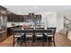 Contemporary kitchen with granite counters, stainless appliances, and center island with barstool seating at 4160 Grandview Vista St, Cumming, GA 30028