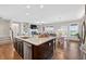 Open concept kitchen with modern appliances, granite countertops, and seamless flow to living spaces at 4160 Grandview Vista St, Cumming, GA 30028