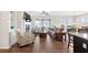 Open-concept living room featuring hardwood floors, a fireplace with built-ins, and large windows that provide natural light at 4160 Grandview Vista St, Cumming, GA 30028