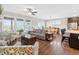 Bright living room featuring hardwood floors, large windows, and an open floor plan at 4160 Grandview Vista St, Cumming, GA 30028