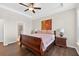 Main bedroom with hardwood floors, tray ceiling, and ensuite bathroom access at 4160 Grandview Vista St, Cumming, GA 30028