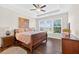 Spacious main bedroom filled with natural light, tray ceiling, and hardwood floors at 4160 Grandview Vista St, Cumming, GA 30028