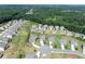 Spacious neighborhood with manicured lawns and a lush green wooded area in the background at 4160 Grandview Vista St, Cumming, GA 30028