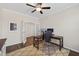 Inviting office space with ceiling fan, two large wooden desks, and neutral rug at 4160 Grandview Vista St, Cumming, GA 30028
