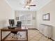 Spacious office space has natural light, a ceiling fan, and a neutral rug at 4160 Grandview Vista St, Cumming, GA 30028