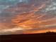 Beautiful sunset with clouds streaked across the sky in shades of orange and pink at 4160 Grandview Vista St, Cumming, GA 30028