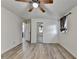 Open-layout bedroom offering ample space, laminate floors, and a modern ceiling fan at 4444 Lisa Nw Way, Lilburn, GA 30047