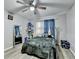 Cozy bedroom with soft textures, a ceiling fan, and natural light from the window at 4444 Lisa Nw Way, Lilburn, GA 30047