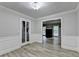 Formal dining room featuring decorative molding and luxury vinyl plank flooring at 4444 Lisa Nw Way, Lilburn, GA 30047