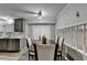 Cozy dining room featuring wood floors, table and chairs, and stainless steel dishwasher at 4444 Lisa Nw Way, Lilburn, GA 30047