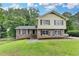 Charming two-story home with a well-maintained lawn and brick and siding exterior at 4444 Lisa Nw Way, Lilburn, GA 30047