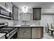 Contemporary kitchen featuring grey cabinets, stainless steel appliances, and quartz countertops at 4444 Lisa Nw Way, Lilburn, GA 30047