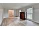 Bright living room featuring hardwood floors, neutral paint, and decorative molding at 4444 Lisa Nw Way, Lilburn, GA 30047