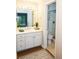 Neat bathroom features a vanity with great lighting and a tiled shower at 591 Emory Oaks Way # 591, Decatur, GA 30033