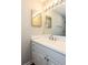 Bathroom features a bright vanity with decorative lighting at 591 Emory Oaks Way # 591, Decatur, GA 30033