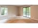 Bedroom with carpet and sliding glass doors to a balcony overlooking trees at 591 Emory Oaks Way # 591, Decatur, GA 30033