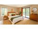 Bright bedroom boasts natural light, balcony access, and modern decor at 591 Emory Oaks Way # 591, Decatur, GA 30033
