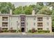 Attractive apartment building offering balconies, mature trees, and convenient parking at 591 Emory Oaks Way # 591, Decatur, GA 30033