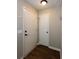 Entryway featuring hardwood-style floors, neutral paint, and a convenient coat closet at 591 Emory Oaks Way # 591, Decatur, GA 30033
