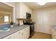 Functional kitchen featuring stainless steel appliances, ample cabinet space, and neutral countertops at 591 Emory Oaks Way # 591, Decatur, GA 30033