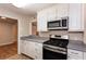 The kitchen showcases white cabinets, stainless steel appliances, and a gas range at 591 Emory Oaks Way # 591, Decatur, GA 30033