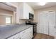 Well-lit kitchen equipped with stainless steel appliances, offering both style and functionality at 591 Emory Oaks Way # 591, Decatur, GA 30033