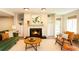 Inviting living room features a cozy fireplace, built-in shelving, and comfortable seating area at 591 Emory Oaks Way # 591, Decatur, GA 30033