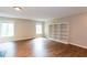 Inviting living room with wood floors, offering ample natural light and built-in bookcases for storage at 591 Emory Oaks Way # 591, Decatur, GA 30033