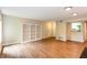 Open-concept living room with wood floors and built-in bookcases, perfect for a modern lifestyle at 591 Emory Oaks Way # 591, Decatur, GA 30033