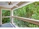 Screened-in porch with views of lush greenery, perfect for relaxing outdoors at 591 Emory Oaks Way # 591, Decatur, GA 30033