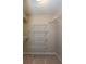 Spacious walk-in closet with built-in wire shelving for organized storage at 591 Emory Oaks Way # 591, Decatur, GA 30033