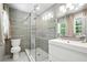 Modern bathroom featuring a glass-enclosed shower, sleek vanity, and stylish tile work at 2676 Cottonwood Dr, Marietta, GA 30066